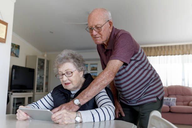 istock Senior Australian Couple Learning To Use Digital Tablet 1157058399
