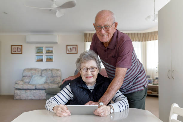 istock Senior Australian Couple Learning To Use Digital Tablet 1157058400