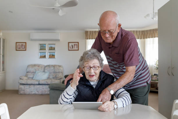 istock Senior Australian Couple Learning To Use Digital Tablet 1157058401