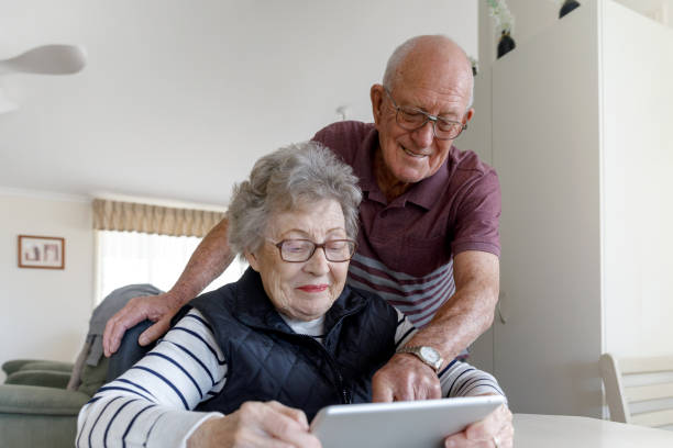 istock Senior Australian Couple Learning To Use Digital Tablet 1157058403