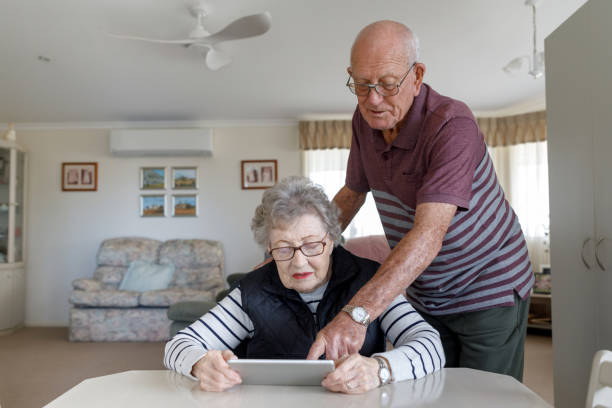istock Senior Australian Couple Learning To Use Digital Tablet 1157058407