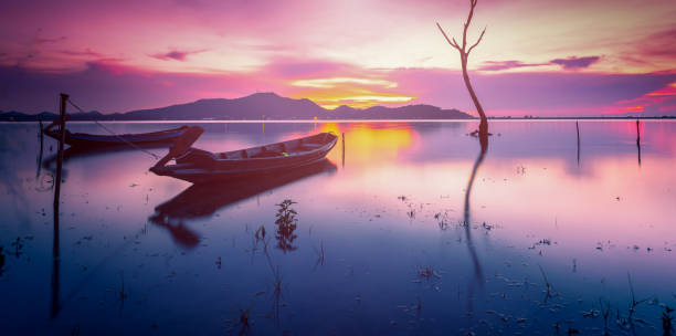 istock Wooden boat on water 1157059387