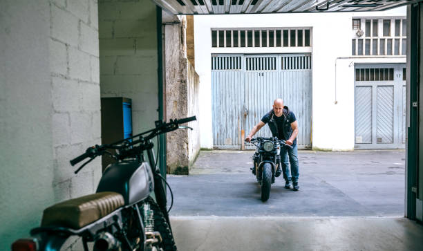 istock Biker taking motorbike to the garage 1157062705