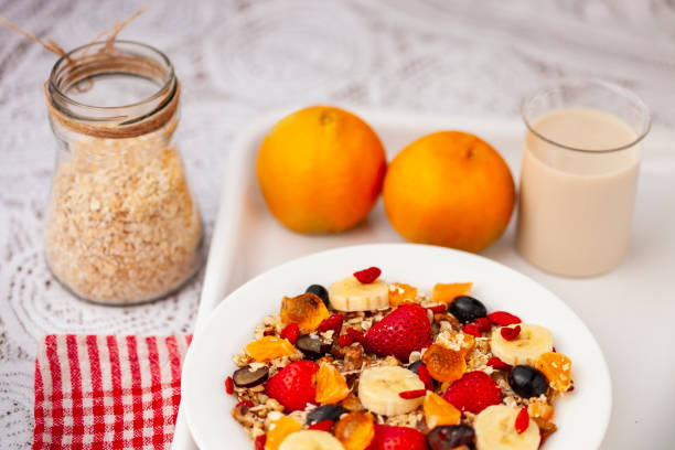 istock Healthy oats breakfast with various fruit toppings and soy milk. 1157062718