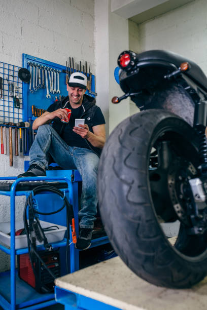 istock Motorcycles mechanic resting having a beer 1157062729