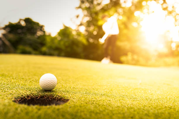 istock Golf balls and golf club 1157063886