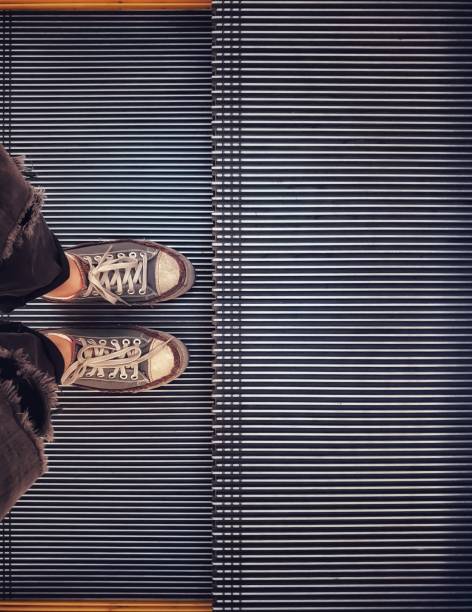 istock Standing on the escalator floor with copy spac 1157064326