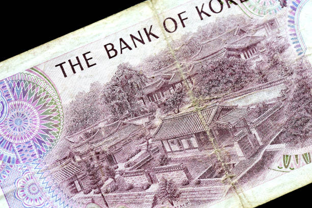 istock Outdated 1000 Korean Won note of 1983 issued on a black background close-up 1157065058