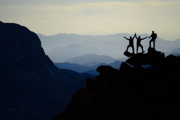 istock great achievements of climber group after climb 1157065869