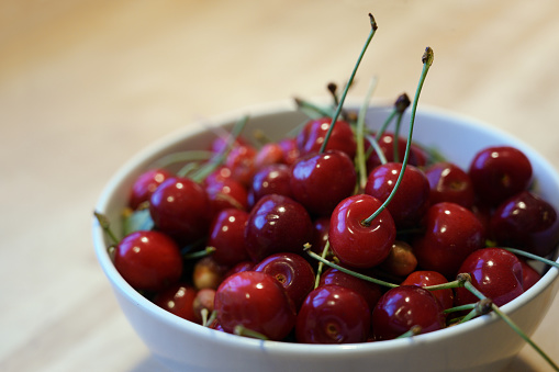 fresh organic cherries from the orchard in a bowl, selected focus, narrow depth of field