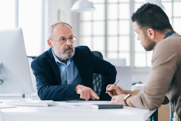istock Senior male manager working with his colleague 1157067225