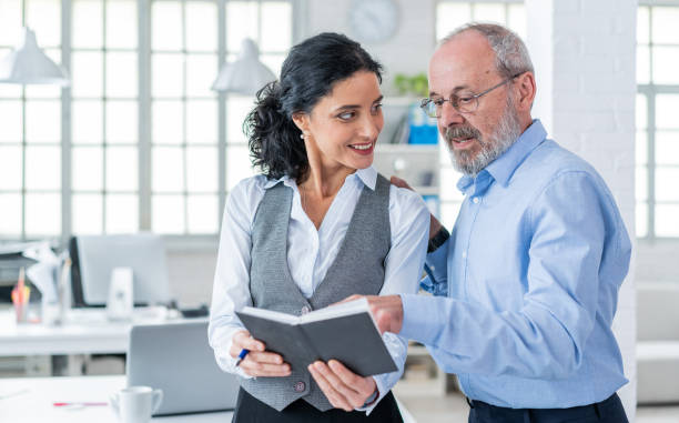 istock Senior male manager working with his assistant secretary 1157067244
