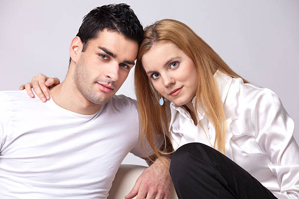 istock relaxed couple watching TV 115707207
