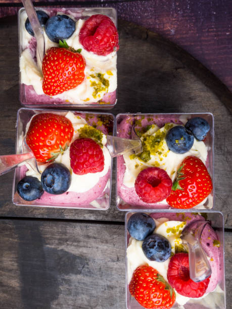 istock Healthy yogurt with berry and nuts, selective focus 1157073694