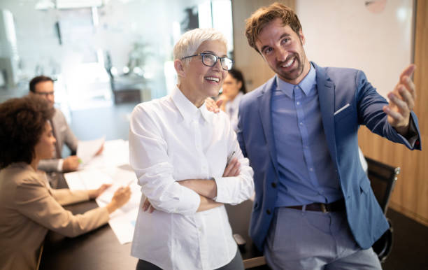istock Happy business colleagues in modern office working together 1157074798