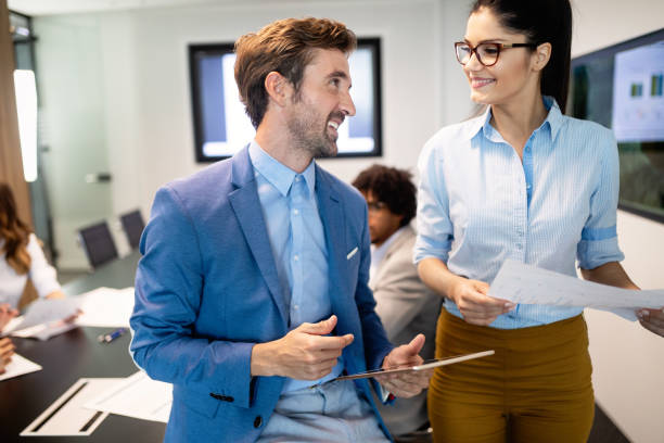 istock Group of successful business people at work in office 1157074802