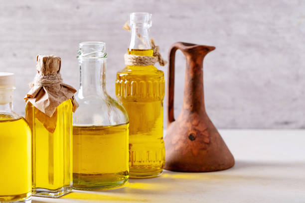 istock Olive oil in glass bottles 1157074899
