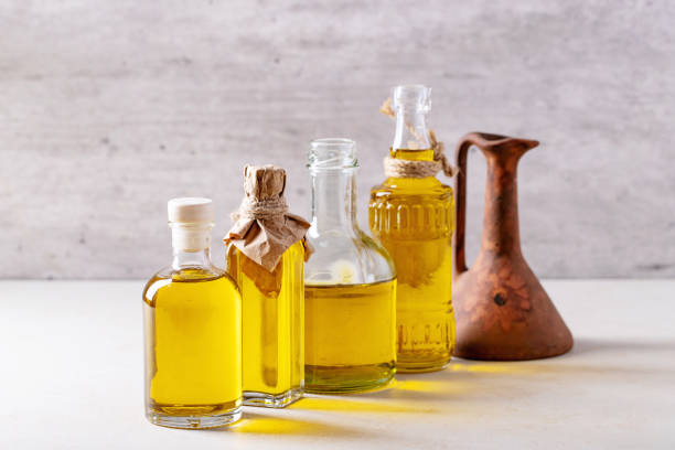 istock Olive oil in glass bottles 1157074902