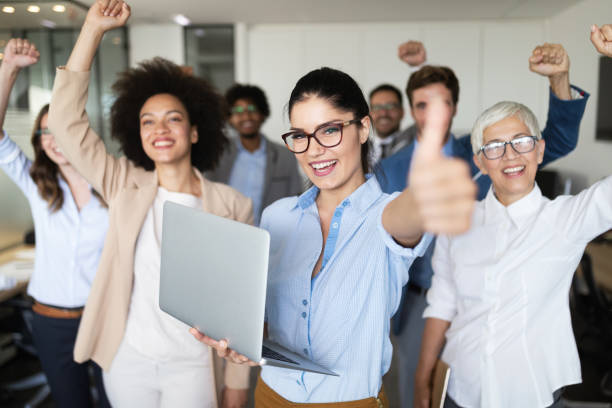 istock Group of successful business people in office 1157075097