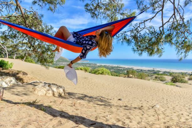 istock Happy woman in hammock. 1157076233