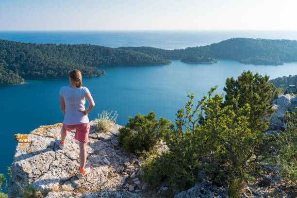 Senior woman looking at Big Lake on Island Mljet, Croatia stock photo