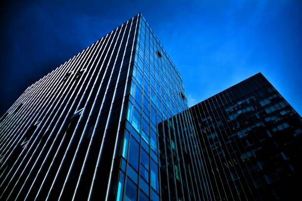 istock Black glass silhouette of skyscraper at night 1157077797