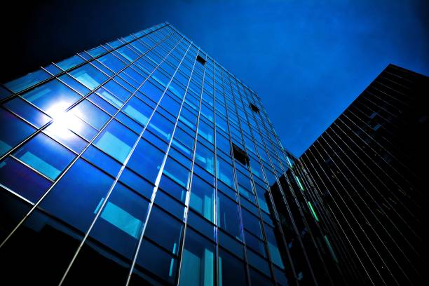 istock Black glass silhouette of skyscraper at night 1157078941