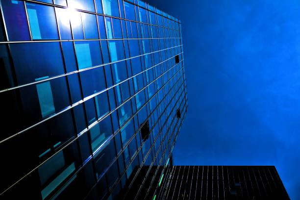 istock Black glass silhouette of skyscraper at night 1157079569