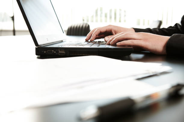 istock working at the office with a laptop 1157080383