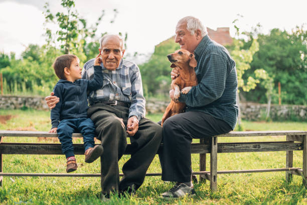 istock Multi-generation family having fun outdoors 1157080610