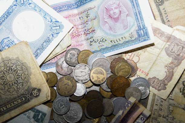 istock old paper banknote and metal coins 1157081288