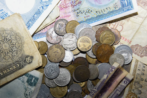 istock old paper banknote and metal coins 1157081313