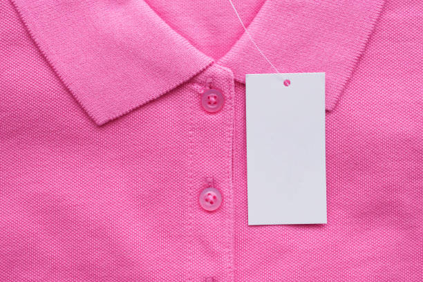 istock Blank white clothes tag label on new shirt 1157081480