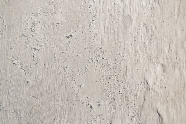 istock Abstract background. The surface of the white limestone wall with texture and roughness 1157083552