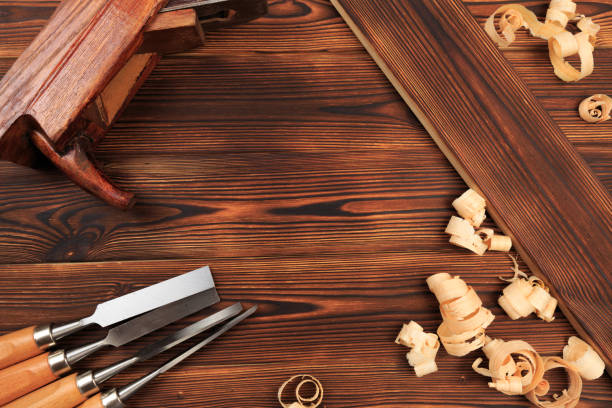 istock chisels plane and sawdust on a wooden table - Image 1157083638