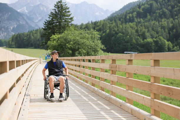 istock Disabled young man on a wheelchair 1157085081