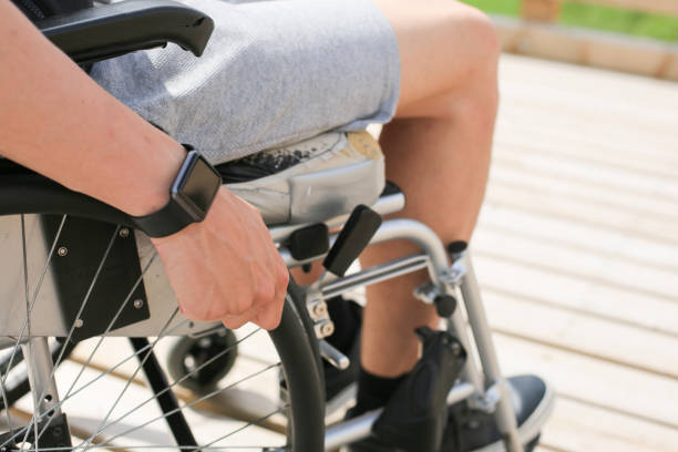 istock Disabled young man on a wheelchair 1157085102