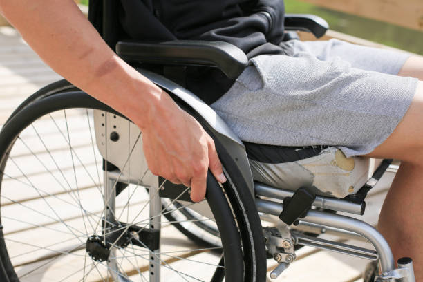 istock Disabled young man on a wheelchair 1157085105