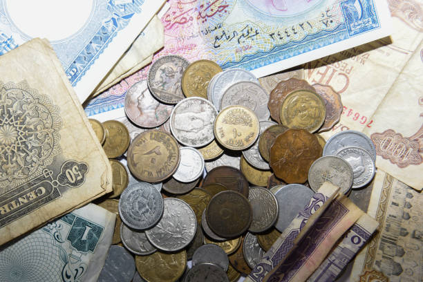istock old paper banknote and metal coins 1157085165
