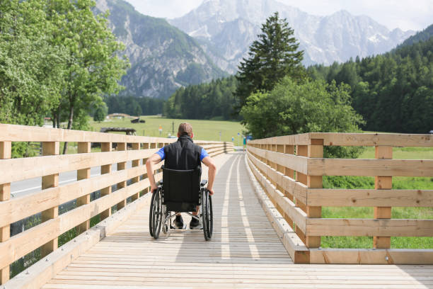 istock Disabled young man on a wheelchair 1157085423