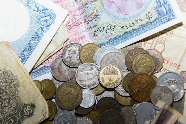 istock old paper banknote and metal coins 1157085841