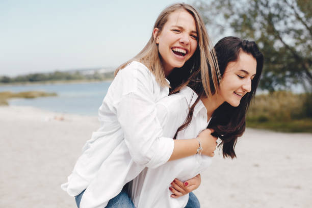 istock Two pretty girls in a summer park 1157087036