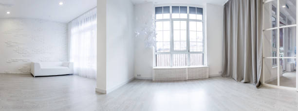 istock White empty room interior with wood floor, window, door. 1157088451