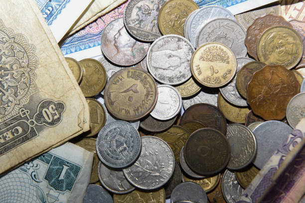 istock old paper banknote and metal coins 1157088528