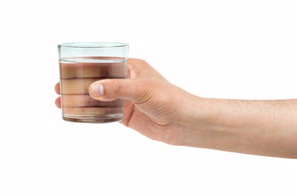 istock hand holding a water glass 1157092826