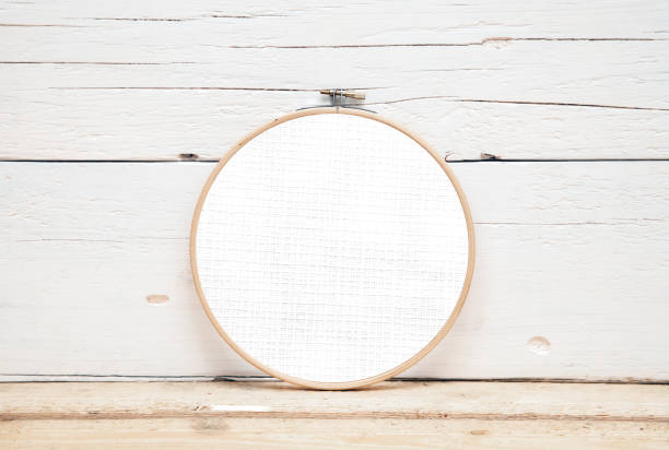 istock hoops for embroidery on a wooden background - a round layout for embroidery 1157093010