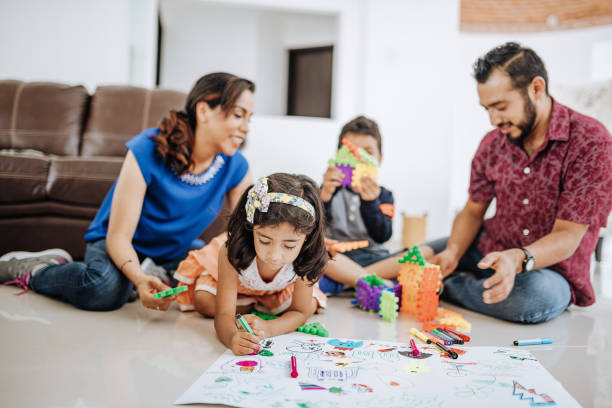 istock Latin preschool siblings playing with parents. 1157093257