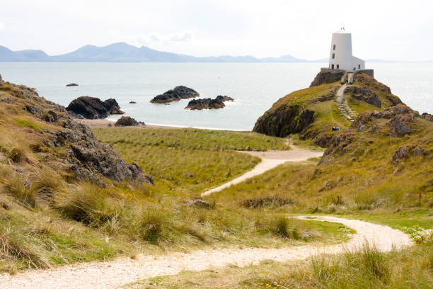 istock Pathway to old lighthouse, Llanddwyn, Anglesey, Gwynedd, Wales, United Kingdom 1157095894