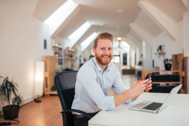istock Portrait of a positive redhead entrepreneur at work. 1157097290