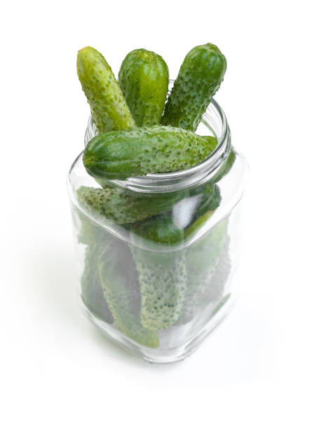 istock cucumbers prepared for preservation in a glass jar 1157097851
